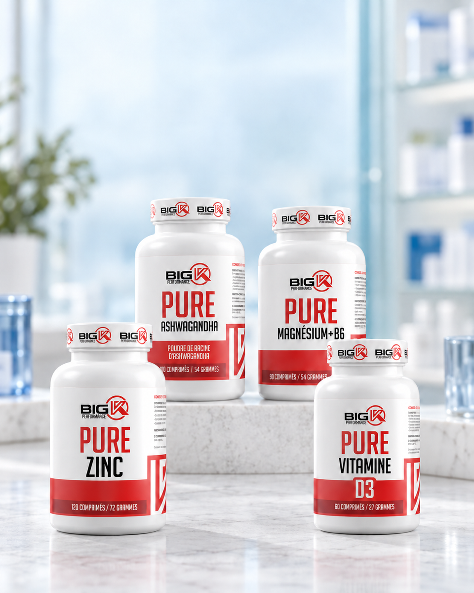 Zinc, ashwagandha, magnésium et vitamine D3 Big K Performance dans un décor clair bleu et blanc.